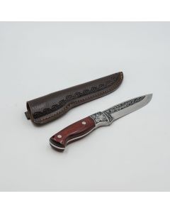 Knife with a brown sheath